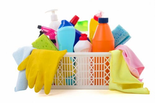 Worker inspecting carpet cleaning tools and chemical use