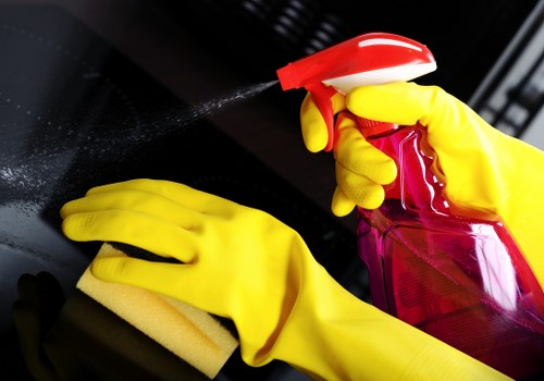 Professional cleaners maintaining a Clapham office kitchen and shared space