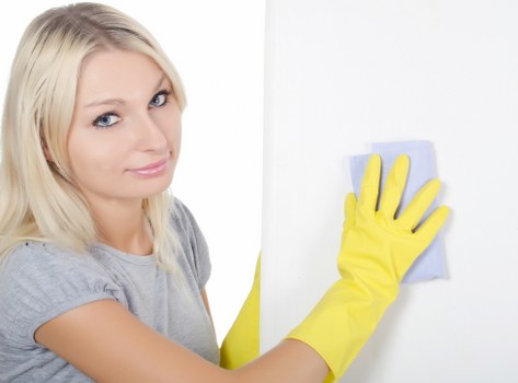 Local technician assessing an upholstery stain in a Clapham flat